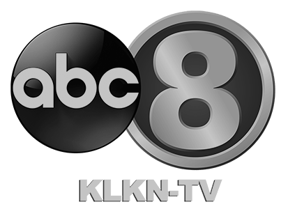 "abc" in a dark sphere to the left and "8" in a dark circle to the right. "KLKN-TV" written below.