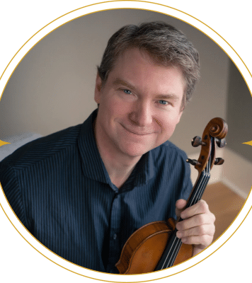 Anton Miller poses with a string instrument