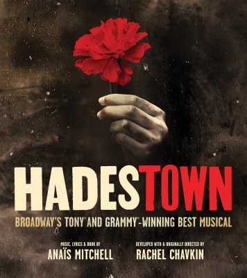 A hand holding a red rose with the text "Hadestown"