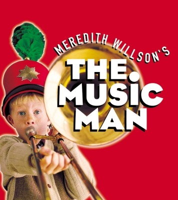 boy playing a trumpet and the text "The Music Man"