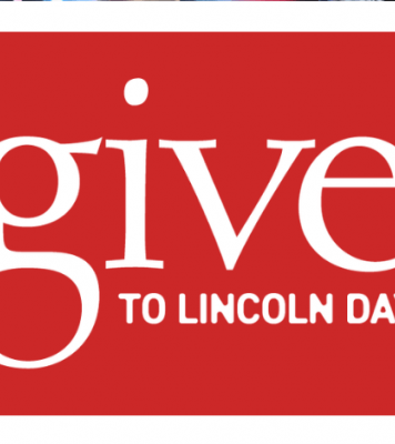 red square with white text: give to Lincoln day