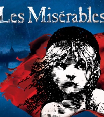 Image that says Les Miserables on the top and a image of a girl from the shoulders up staring into the disbands with a red and blue background.