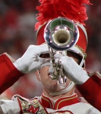 a unl student plays the trumpet in marching band uniform