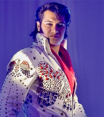 man who looks like Elvis and impersonates the king's singing and dancing