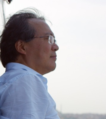 a man with glasses stares off into the unknown