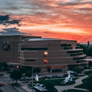 Exterior photo of the Lied Center at sunset