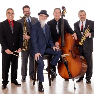 five men in suits pose together with their jazz ensemble instruments