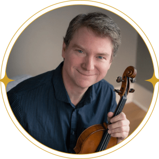 Anton Miller poses with a string instrument