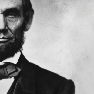 Half of Abraham Lincoln's face and shoulders in the frame