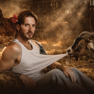 a man poses in front of a farm scene with animals