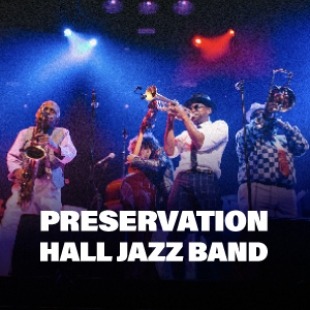 Several men playing jazz instruments and bright lights shining down with Preservation Hall Jazz Band text at the bottom