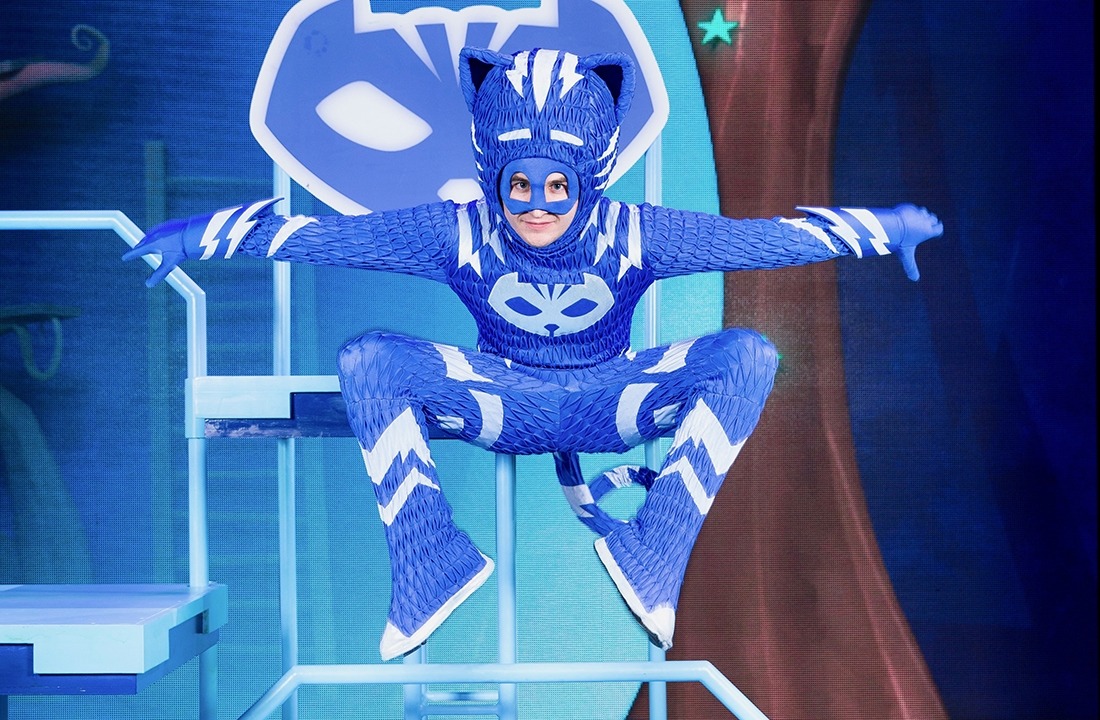 Image of PJ Mask's Catboy dressed in a blue costume and leaping in the air like a cat superhero.