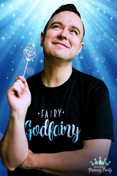 Ben in a black shirt in front of a blue background