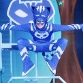Image of PJ Mask's Catboy dressed in a blue costume and leaping in the air like a cat superhero.