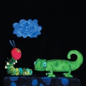 The very hungry caterpillar puppet looks up at a cloud prop with a green chameleon puppet next to him
