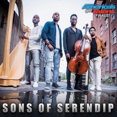 four men standing in a city street holding a variety of stringed instruments