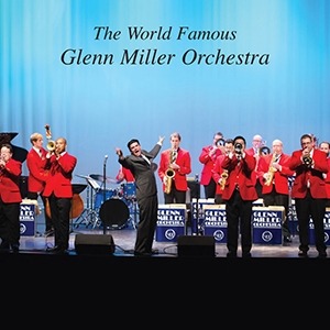 An image with several musicians from the Glenn Miller Orchestra being directed on a stage.
