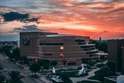 Exterior photo of the Lied Center at sunset