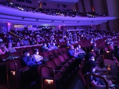 A socially-distanced audience fills the Lied Center.