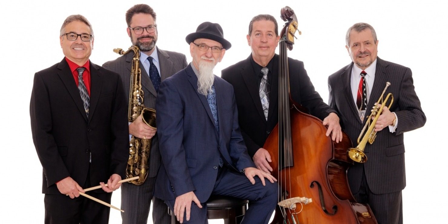 five men in suits pose together with their jazz ensemble instruments