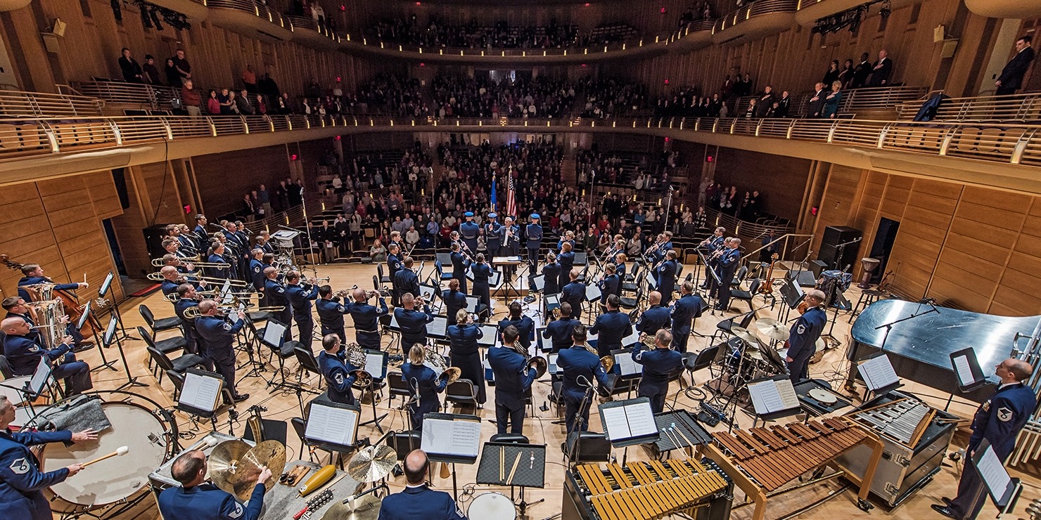 Image of the USAF Band and Singers performing in a concert hall.