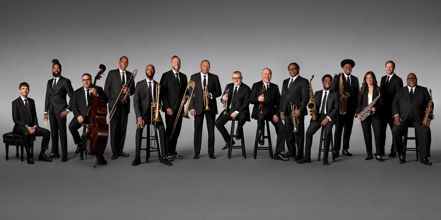 large group of musicians pose together