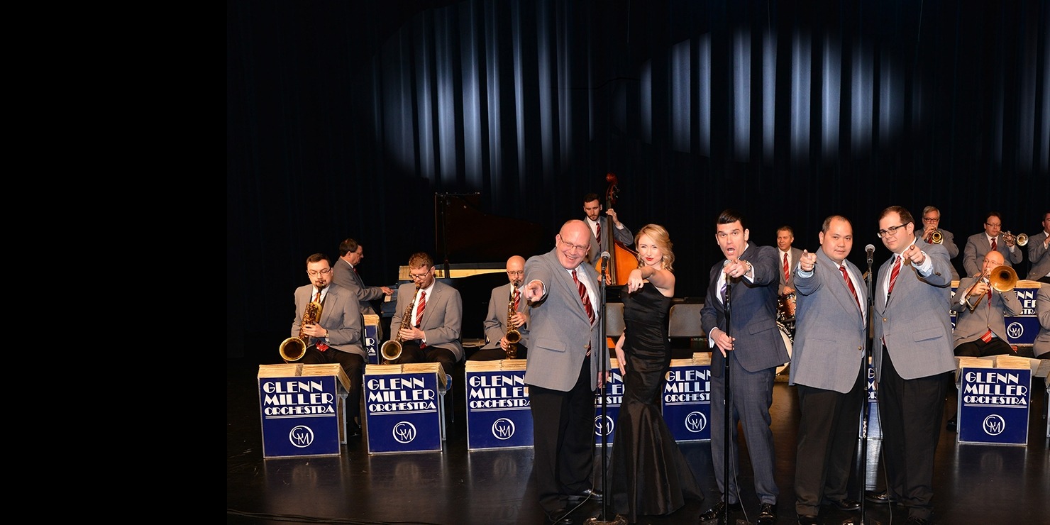 An image of the Glenn Miller Orchestra performing a concert on stage.