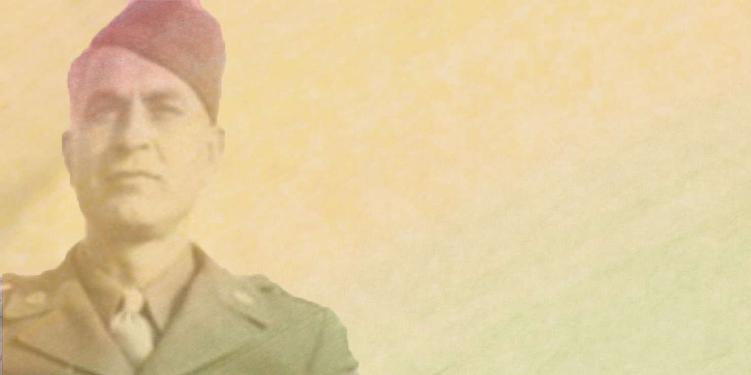 Image of man with military suit and hat on.