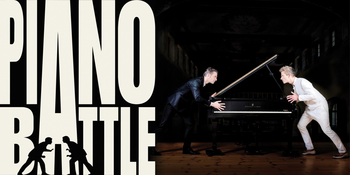 two men face to face across a piano, clearly in battle-mode