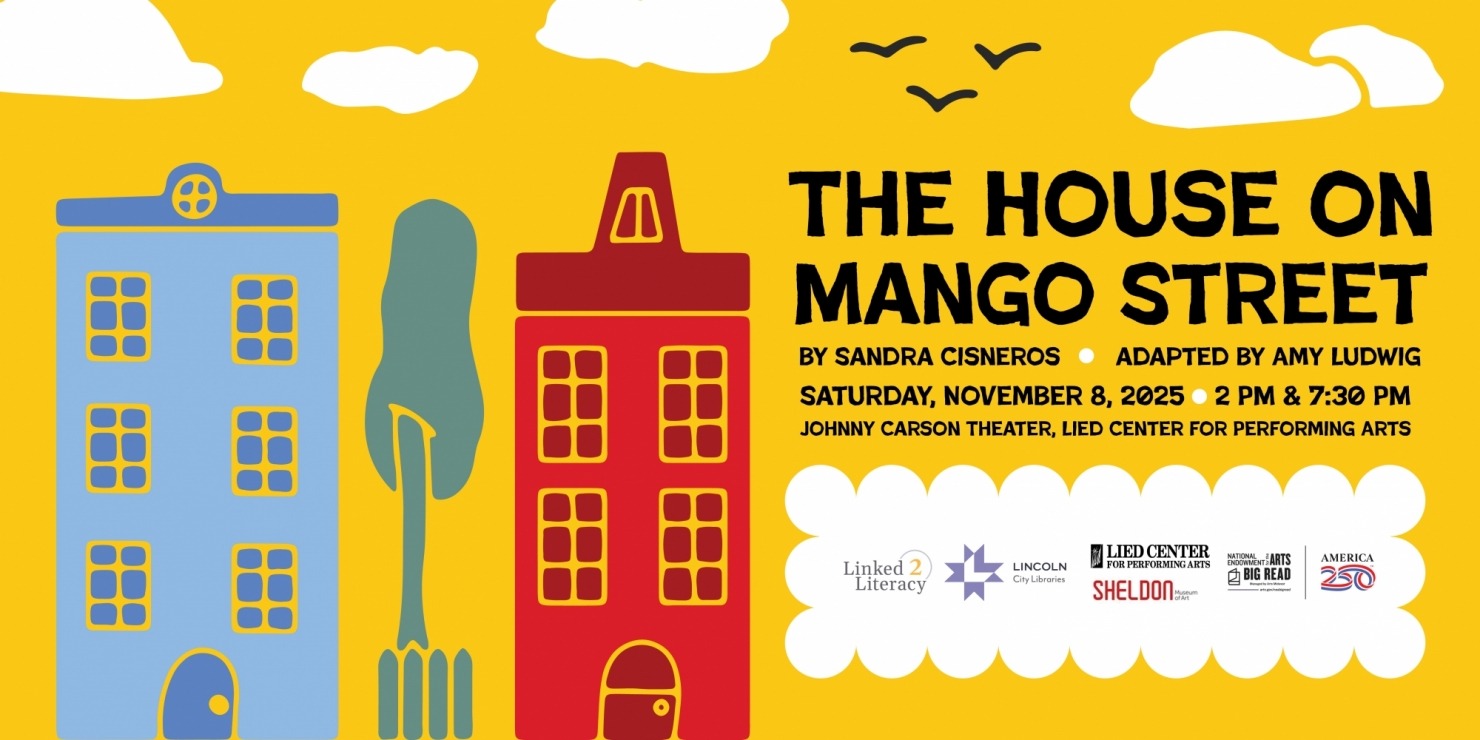 a blue house and a red house side by side with a tree in the middle