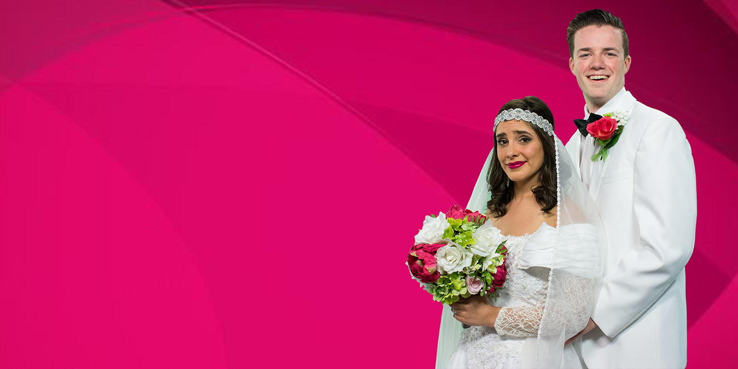 Tony 'n Tina's wedding couple in white wedding clothes on a pink background