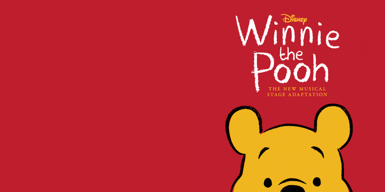 Yellow bear peaks the top of his head from the bottom of the image. He has black eyebrows, nose, and eyes. Above him there are the words "A new adventure is about to happen, Disney Winnie the Pooh, The new musical stage adaptation, Created by Jonathon Rockefeller." In the colors yellow and white. The background of the image is red.