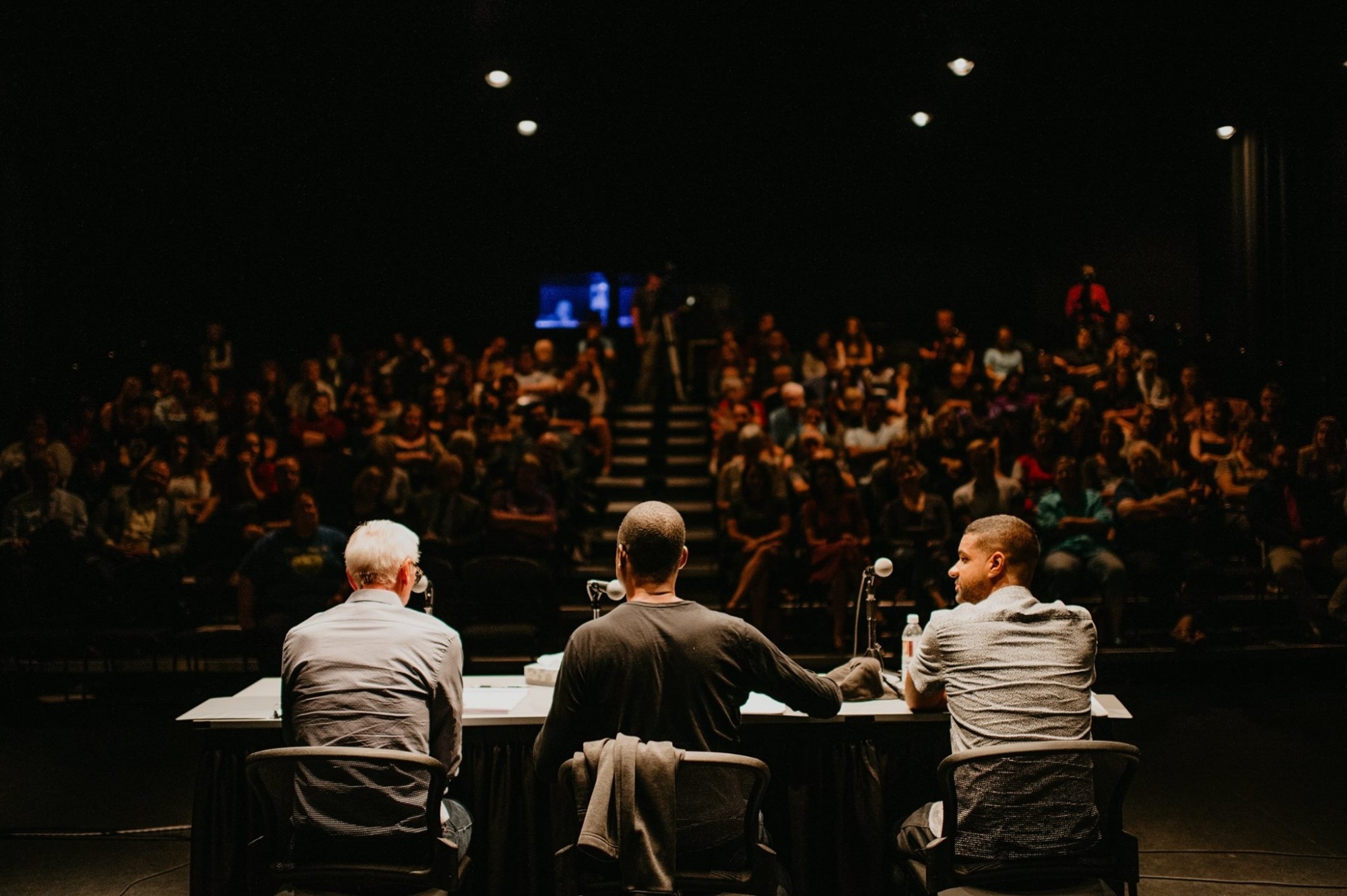Image from behind the three-person expert panel looking toward the audience during the ASCAP panel review