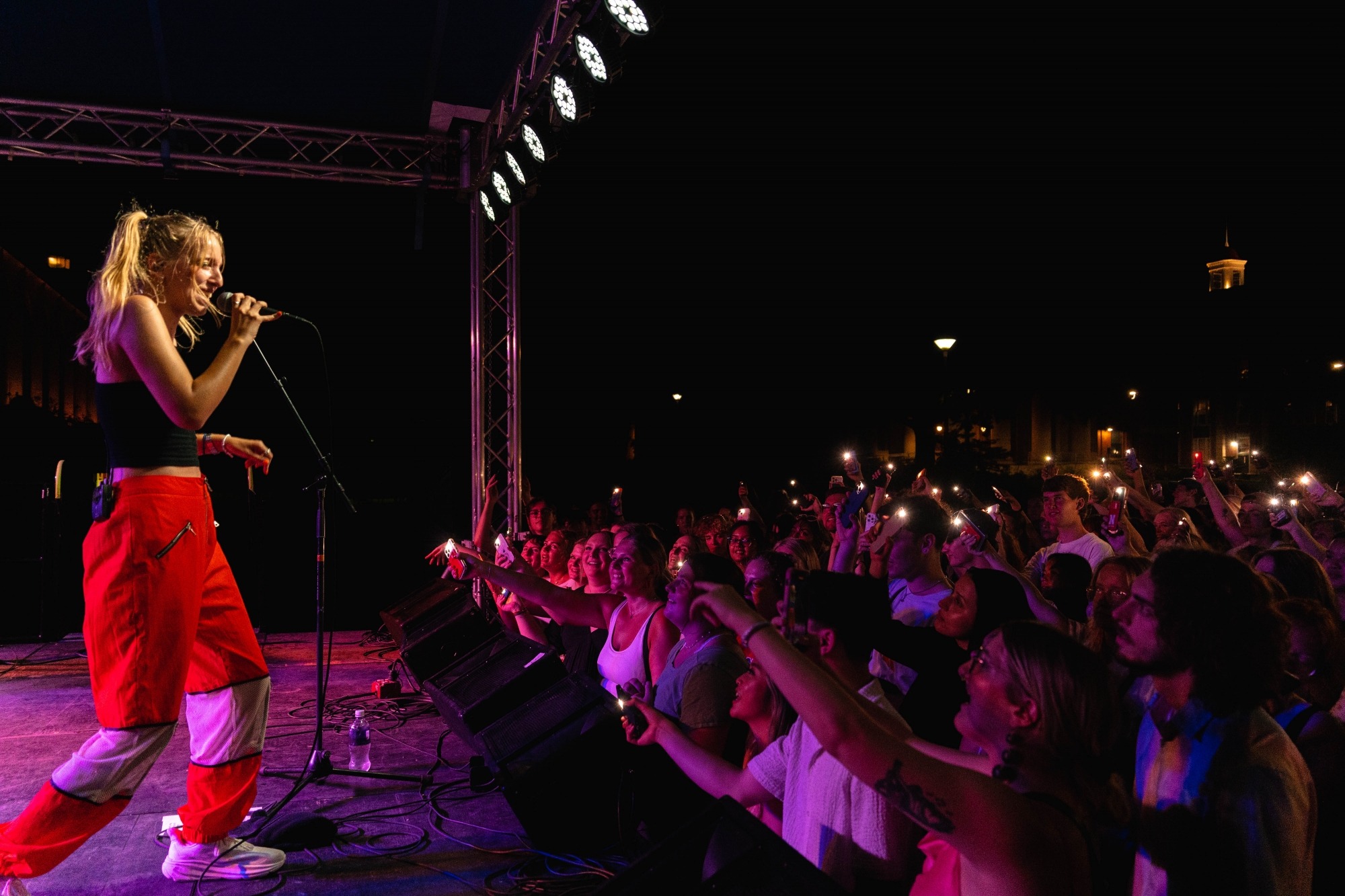 Students cheering at the Big Red Lied Experience concert, featuring artists Maude Latour.