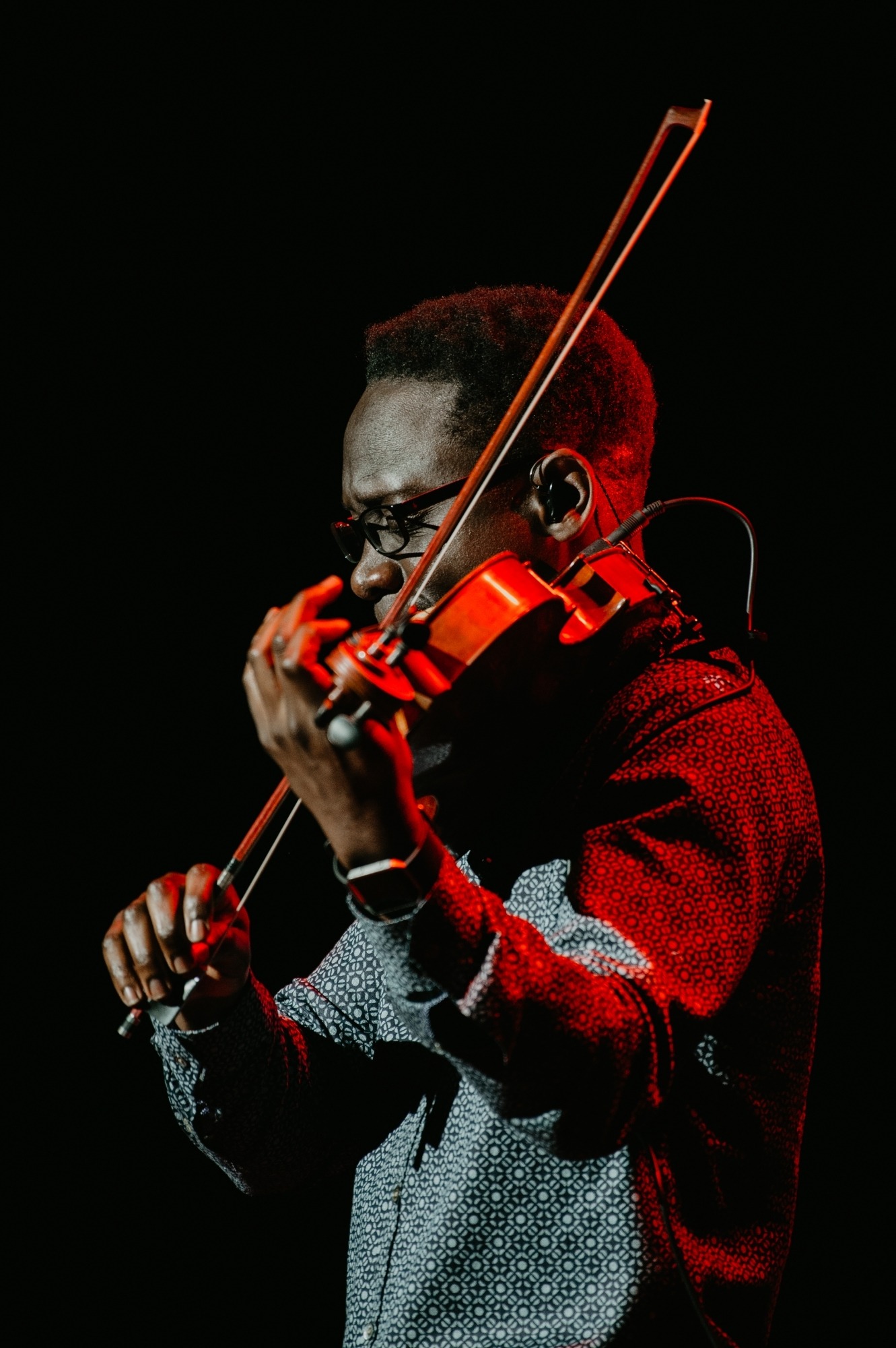 Image of one of the members of Black Violin playing his violin