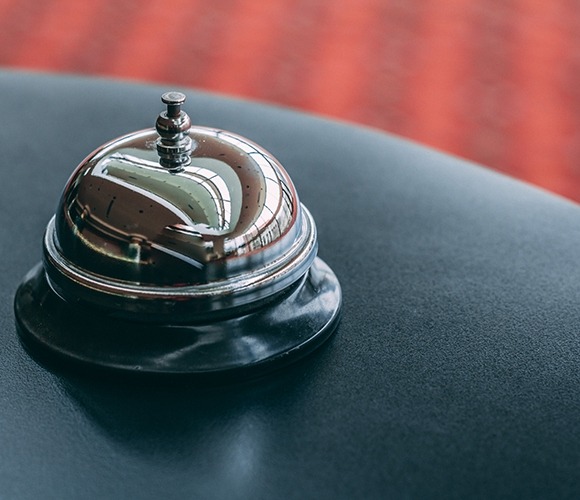 Image of a bell on a hotel counter