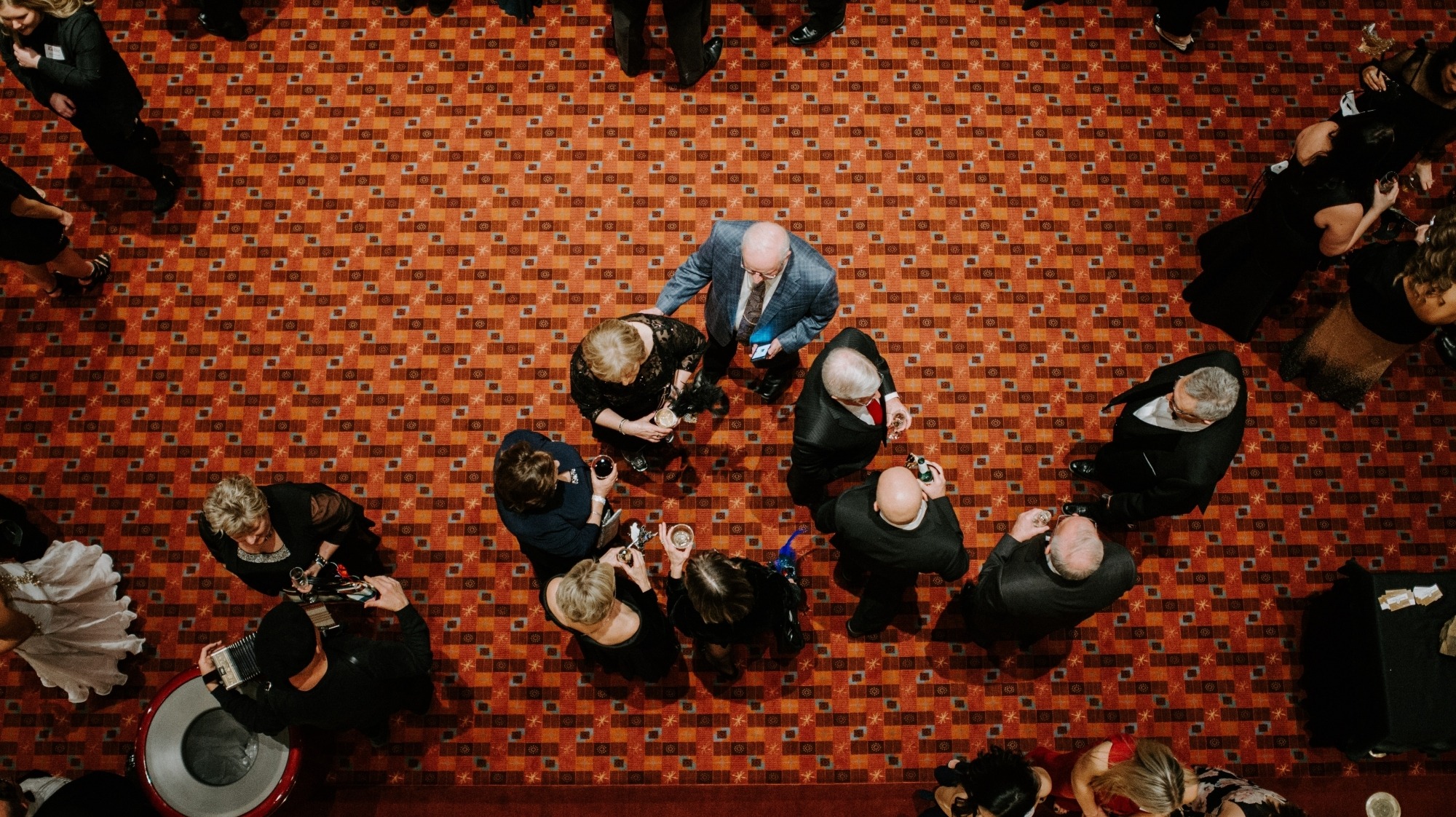 Image from above the Lied Center Orchestra Lobby showing patrons mingling and enjoying cocktails before the Friends of Lied Gala