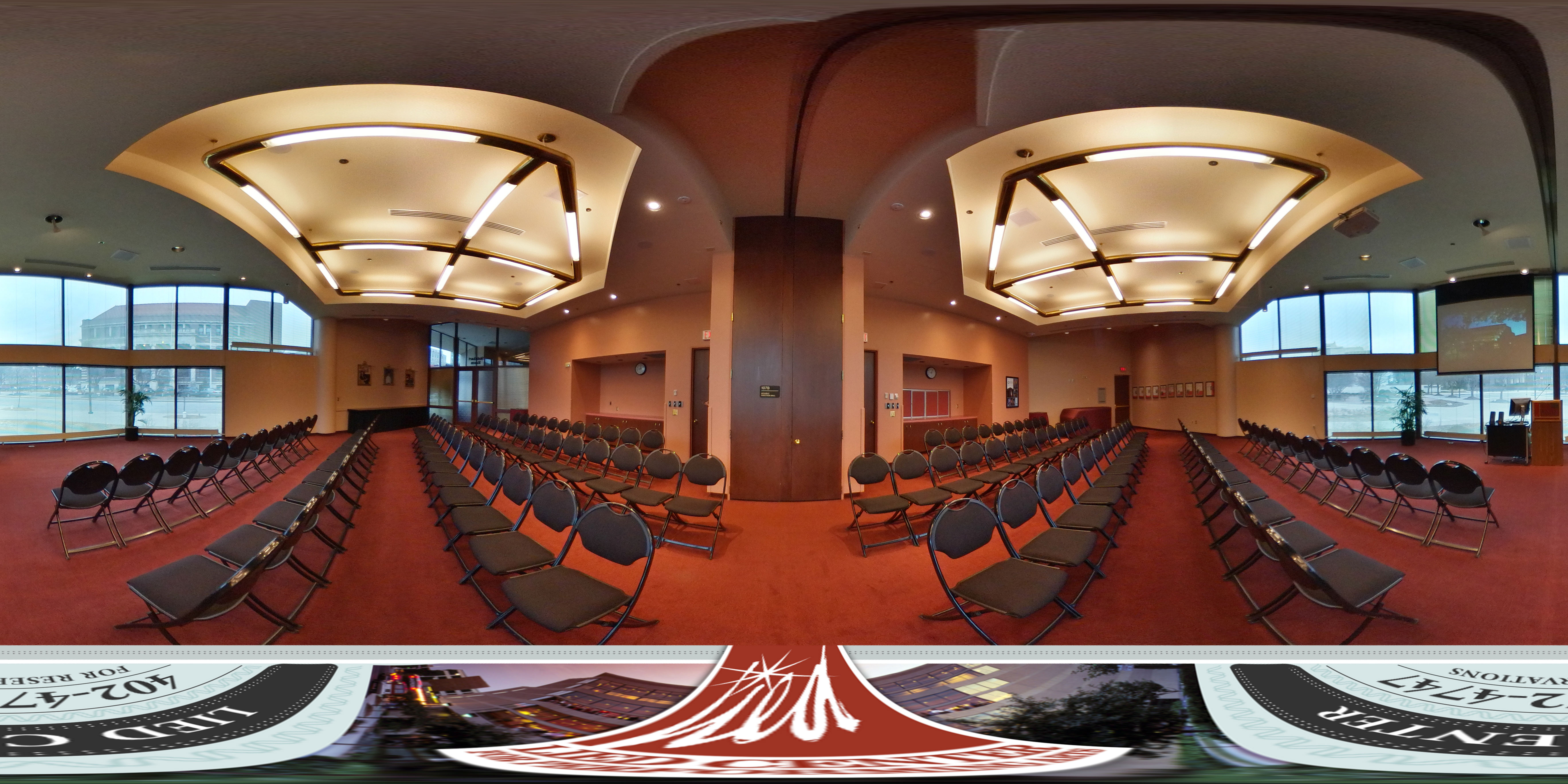 Virtual tour of the Lied Center Steinhart Room showing the view of the campus, projection screen and A/V cart, and the black chairs set up for a lecture.